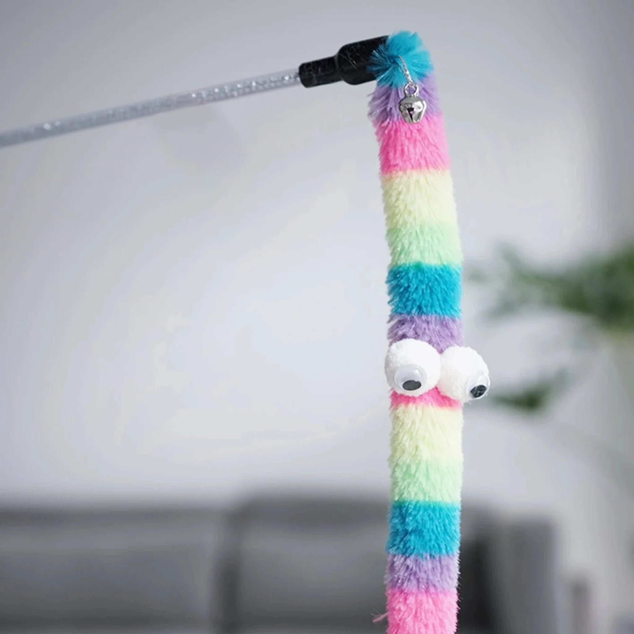 Colorful striped cat toy on a white background