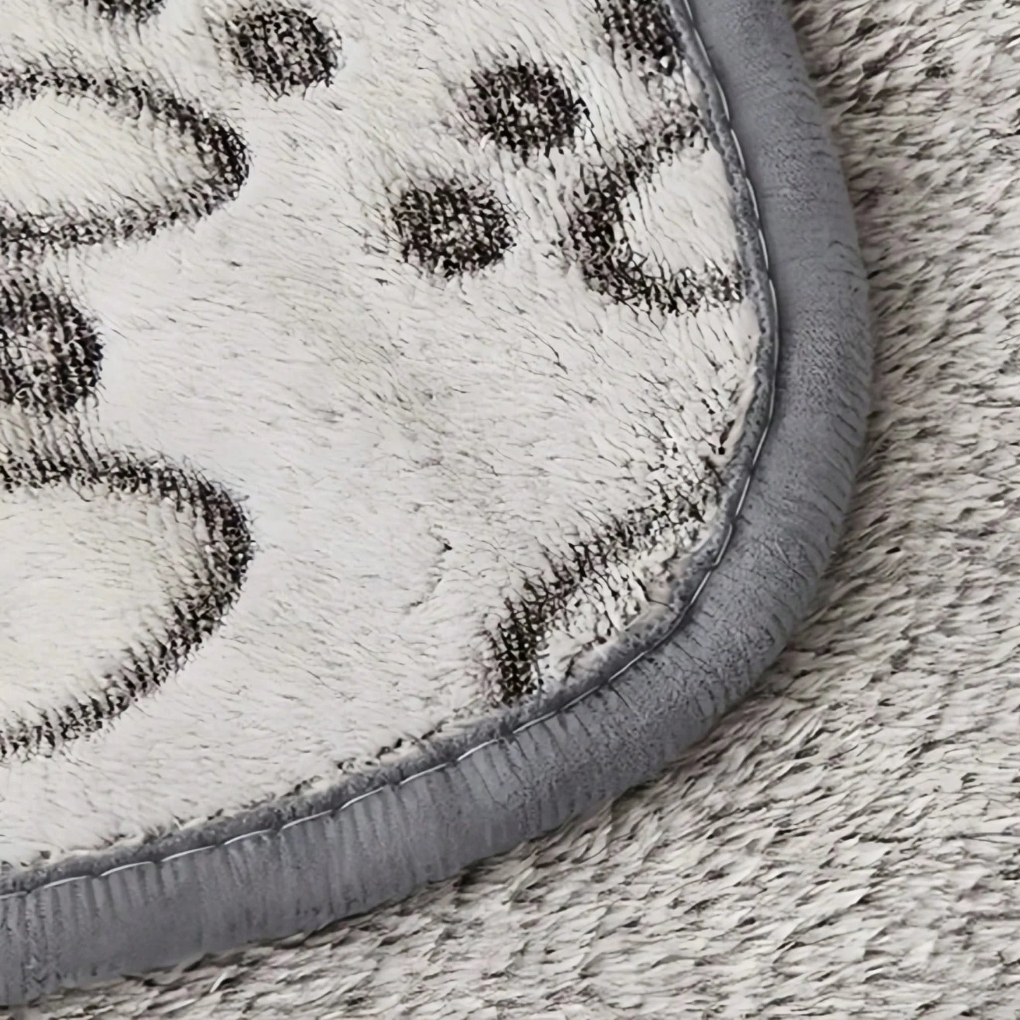 A beige or light-colored pet blanket with a bubble or sherpa-like texture, neatly folded on a white surface. Petsovo