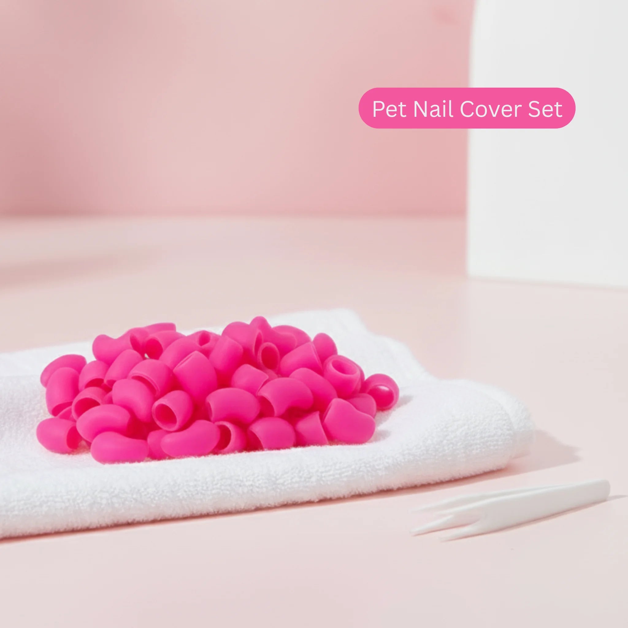 Pink pet nail covers on a white towel, pet product